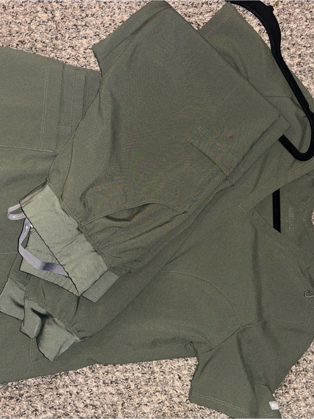 Maevn scrub set in olive green 3 pocket top with jogger pants.